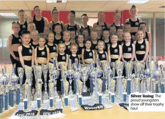  ??  ?? Silver lining The proud youngsters show off their trophy haul