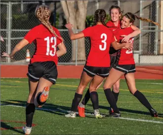  ?? Cory Rubin/The Signal (See additional photos on signalscv.com) ?? The Hart girls soccer team celebrates Alyssa Irwin’s second-half goal, which allowed them to beat El Dorado High School in the first round of the CIF-Southern Section Division 1 tournament at Hart.