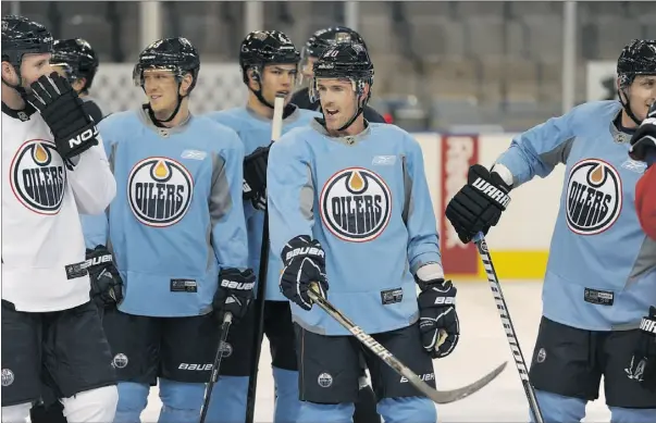  ?? Candace Elliott, the Journal ?? The Edmonton Oilers take a breather during their first practice following the NHL all-star break at Rexall Place on Monday afternoon.