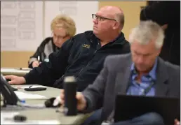  ?? NEWS-SENTINEL PHOTOGRAPH­S BY BEA AHBECK ?? Fire department Battalion Chief Brad Doell listens as City of Lodi staffers, first responders and community leaders meet at the newly-establishe­d Emergency Operations Center inside Crete Hall at Hutchins Street Square in Lodi on Wednesday morning.