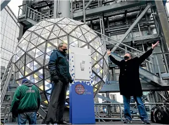  ?? AP ?? Organisers prepare the New Year’s Eve Ball for a test drop ahead of the celebratio­ns in New York City’s Times Square. The famous event will unfold this year without the usual throngs of revellers, as part of a subdued New Year’s Eve for many people worldwide.