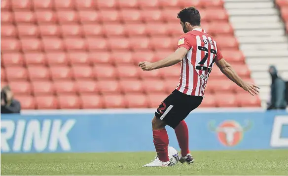  ??  ?? Will Grigg takes a penalty during the shooutout defeat against Hull City