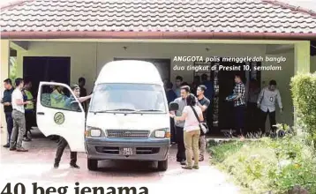  ??  ?? ANGGOTA polis menggeleda­h banglo dua tingkat di Presint 10, semalam.