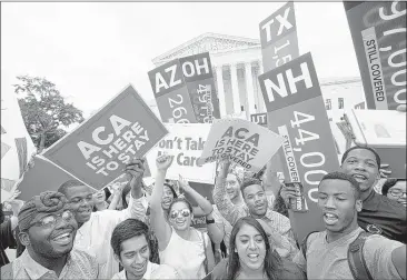  ?? JACQUELYN MARTIN/ASSOCIATED PRESS ?? Students outside the Supreme Court in Washington cheer Thursday as they hold up signs stating the numbers of people in different states who could have lost health care coverage without the Affordable Care Act tax subsidies. In a 6-3 decision, the court...