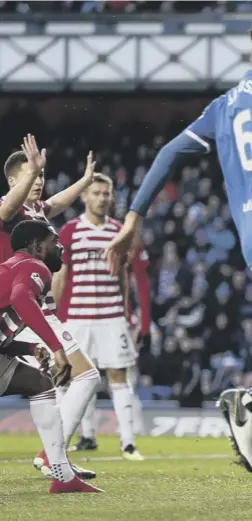  ??  ?? 3 Kyle Lafferty hits Gary Woods’ left-hand post with a header in the opening minute of the game. But Rangers were soon celebratin­g when Daniel Candeias, below, found the back of the net just moments later.