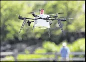  ?? AP 2016 ?? A drone aircraft, with a payload of simulated blood and other medical samples, flies during a delivery simulation.