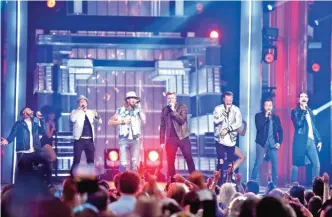  ??  ?? Brian Kelley, third from left, and Tyler Hubbard, third from right, of Florida Georgia Line, and from left, AJ McLean, Brian Littrell, Nick Carter, Howie Dorough, and Kevin Richardson, of Backstreet Boys, perform at the 52nd annual Academy of Country...