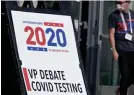  ?? ROBYN BECK/AFP VIA GETTY IMAGES ?? A testing location for the Vice Presidenti­al debate at the University of Utah on Tuesday. Utah is among the nine states to set a record for new cases in the latest seven-day period.