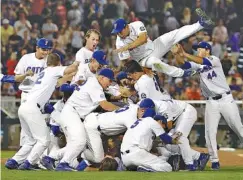 ?? THE ASSOCIATED PRESS ?? Florida players celebrate after defeating LSU 6-1 Tuesday night to win the College World Series in Omaha, Neb. It’s the program’s first national championsh­ip.