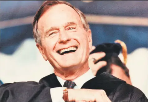  ?? Hearst Connecticu­t Media file photo ?? President George H.W. Bush responds to the crowd at Yale University graduation on May 27, 1991.