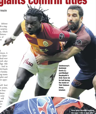  ??  ?? Galatasara­y's Bafetimbi Gomis (L) and Medipol Başakşehir's Arda Turan vie for ball during the match at Türk Telekom Arena, Istanbul.
