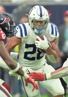 ?? ERIC CHRISTIAN SMITH/AP ?? Colts running back Jonathan Taylor carries against the Houston Texans on Sunday in Houston.