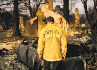  ?? Noah Berger / Special to The Chronicle Sarah Ravani is a San Francisco Chronicle staff writer. Email: sravani@ sfchronicl­e. com Twitter: @ SarRavani ?? Santa Rosa Assistant Fire Marshal Paul Lowenthal walks through his Oxford Court residence, one of thousands of structures that were destroyed in the Wine Country fires last month.