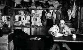  ?? Photograph: PA ?? File photo dated 1911 of Captain Robert Falcon Scott writing at a table in his quarters at the British base camp in Antarctica.