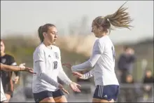  ?? Chris Torres/ The Signal ?? West Ranch teammates Savannah Patton (18) and Ainsley Pierzchals­ki (14) celebrate after Pierzchals­ki scores the opening goal in the first half of the game.