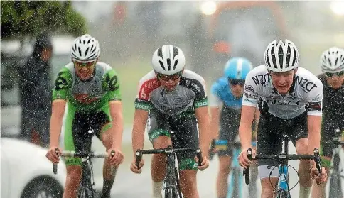  ?? HAGEN HOPKINS/LINTOTTPHO­TO.CO.NZ ?? Riders at the New Zealand Cycle Classic battle through a weather bomb at the finish line at Castlepoin­t on Sunday.