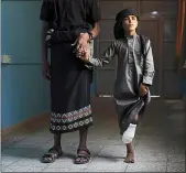  ??  ?? Saleh Raken lost a leg while playing near his home. Officials believe land mines in Yemen could pose a danger to civilians for decades to come.