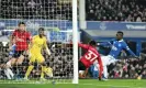  ?? ?? Manchester United’s Kobbie Mainoo clears Dwight McNeil’s shot off the line and away from Idrissa Gueye in the first half at Goodison Park. Photograph: Michael Regan/ Getty Images