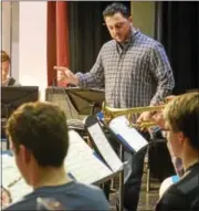  ?? BOB RAINES — DIGITAL FIRST MEDIA ?? David DiValentin­o, center, leads the North Penn Jazz Band through a rehearsal for their trip to New Orleans.