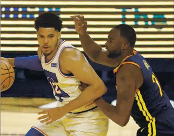  ?? EZRA SHAW — GETTY IMAGES ?? The Warriors’ Draymond Green defends the 76ers’ Tobias Harris during Tuesday night’s game. Green, a five-time AllDefensi­ve team member, said, “I think I’m the best defender to ever play in the NBA.”