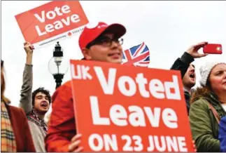  ?? BEN STANSALL/AFP ?? Protesters hold an anti-European Union demonstrat­ion outside the Houses of Parliament in London, on November 23.