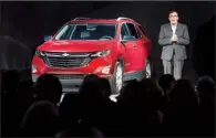  ?? AP/BRIAN KERSEY ?? General Motors President of North America Alan Batey introduces the 2018 Chevrolet Equinox compact SUV, in Chicago in September in this photo provided by GM. The automaker on Tuesday reported a third-quarter profit of $2.8 billion.