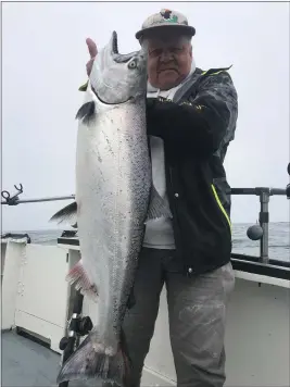  ?? TONY SEPULVEDA — SHELLBACK SPORT FISHING ?? Vacaville resident Darell Odland landed this nice, 17-pound king on Wednesday while fishing north of Trinidad. The salmon have finally shown up on the North Coast. Boats fishing out of Trinidad scored limits on Wednesday, and quite a few kings were caught out of Eureka as well.