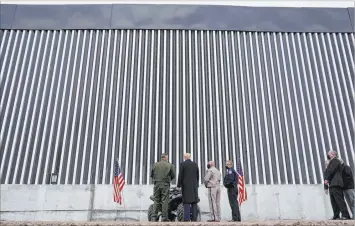  ?? Alex Brandon The Associated Press ?? President Donald Trump tours a section of the U.S.Mexico border wall under constructi­on Tuesday in Alamo, Texas.