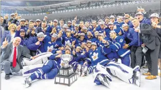  ?? TORONTO MARLIES PHOTO ?? The Toronto Marlies pose for a team photo after their historic Calder Cup win Thursday night in Toronto. Colin Greening of St. John’s was part of the championsh­ip team, and is standing between Marlies general manager Kyle Dubas (wearing black glasses)...