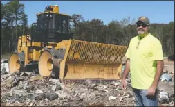  ?? The Sentinel-Record/Richard Rasmussen ?? NEW LEADERSHIP: Billy Sawyer, standing in front of a compactor at the Cedar Glades Landfill Tuesday, will be the new director of the county’s environmen­tal services department starting next week. He’s been the assistant director since 2015.