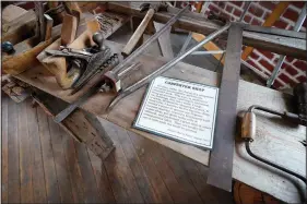  ?? (AP/Charlie Neibergall) ?? Tools used in a carpentry shop are seen on display Oct. 27 in a museum at the former Genoa Indian Industrial School.