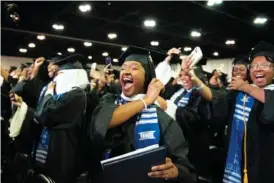  ?? JULIE YARBROUGH, SPELMAN COLLEGE VIA AP ?? Participan­ts in the Spelman College 136th Commenceme­nt celebrate in May in College Park, Ga.