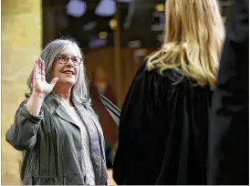  ?? RICARDO B. BRAZZIELL / AMERICAN-STATESMAN ?? Austin City Council Member Leslie Pool, shown at her 2017 swearing-in, leads opposition to a Precourt deal. The McKalla Place site is in her district.