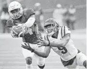  ?? Ron Jenkins / Getty Images ?? Cornerback Xavien Howard, left, collected 10 intercepti­ons in three years at Baylor.