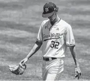  ?? Butch Dill / Associated Press ?? Texas A&M’s John Doxakis held Georgia hitless through eight innings before he was relieved in the ninth.