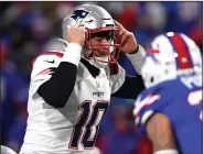  ?? (AP/Adrian Kraus) ?? New England Patriots quarterbac­k Mac Jones attempted only three passes because of high winds and cold temperatur­es during Monday night’s victory over the Buffalo Bills at Orchard Park, N.Y.