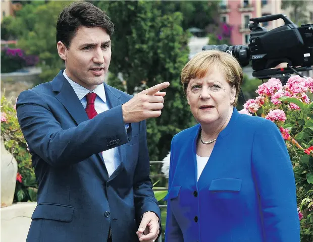 ?? SEAN KILPATRICK / THE CANADIAN PRESS FILES ?? Prime Minister Justin Trudeau and German Chancellor Angela Merkel take part in the G7 Summit in Italy last month.