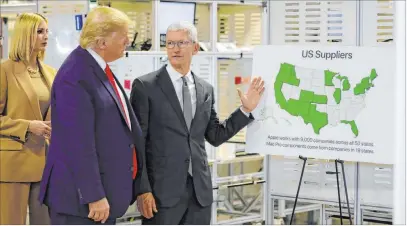  ?? Evan Vucci The Associated Press ?? President Donald Trump tours an Apple plant in Austin, Texas, Wednesday with adviser Ivanka Trump and Apple CEO Tim Cook.