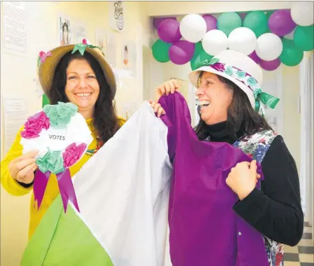  ?? PHOTO: DUNCAN BROWN ?? Heretaunga Women’s Centre service co-ordinator Cathy Barclay (left) and manager Margot Wilson preparing a display for upcoming Suffrage Day events.