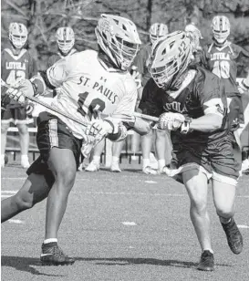  ?? KEVIN RICHARDSON / BALTIMORE SUN ?? LB — C. Koras, Dixon, Burnam, Rice, Cook; SP — Chizmar 3, O’Day.
LB Webb 10; SP — Watkinson 9.
4-4
St. Paul’s Kabe Clark, left, moves with the ball as he takes a check from Loyola Blakefield midfielder Michael Haus during a game Tuesday.