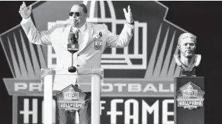  ?? David Richard / Associated Press ?? Former Houston Oilers linebacker Robert Brazile delivers his speech during inductions at the Pro Football Hall of Fame on Saturday. Brazile waited 34 years to be inducted into the Hall.