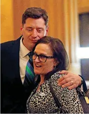  ??  ?? David Holt hugged his former teacher Diane Welker at his election night watch party Tuesday at the First National Center in downtown Oklahoma City. Holt swept aside two opponents to become mayor.
