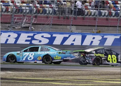  ?? CHUCK BURTON — THE ASSOCIATED PRESS, FILE ?? Martin Truex Jr., (78) and Jimmie Johnson (48) crash on the final lap during the 2018NASCAR Cup Series race at Charlotte Motor Speedway in Concord, N.C. Charlotte Motor Speedway will host the Coca-Cola 600on May 24, which will mark 60consecut­ive years the longest race on the NASCAR schedule will be held on Memorial Day weekend.