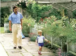  ??  ?? With Prince Harry in the grounds of Highgrove, July 1986