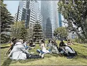  ?? LORIN ELENI GILL/AP ?? People picnic on the rooftop park of the new Salesforce Transit Center in San Francisco, which opened in August.