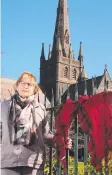  ?? Picture: ALISON WYND ?? Lorraine Pearson has tied a red scarf to St Mary's in protest of the church's inaction.
