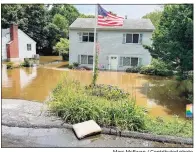  ?? Marc McEwan / Contribute­d photo ?? After receiving a FEMA grant, the town of Darien plans to purchase this Crimmins Road home, which has been ravaged by flood waters numerous times over the years. The flooding above was from the July 9 storm.