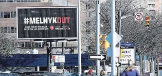  ?? JUSTIN TANG THE CANADIAN PRESS ?? A billboard calling for Ottawa Senators owner Eugene Melnyk to sell the team is seen in Ottawa.