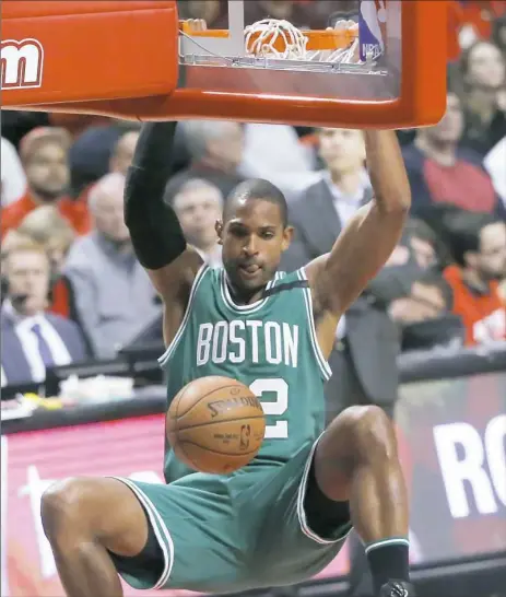  ?? Charles Rex Arbogast/Associated Press ?? Al Horford dunks against Chicago in the second half of Game 3 of the Celtics-Bulls first-round playoff series Friday night.