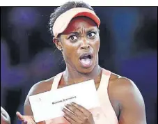  ?? AFP ?? Sloane Stephens reacts after receiving the winner’s cheque at the US Open in New York on Saturday.